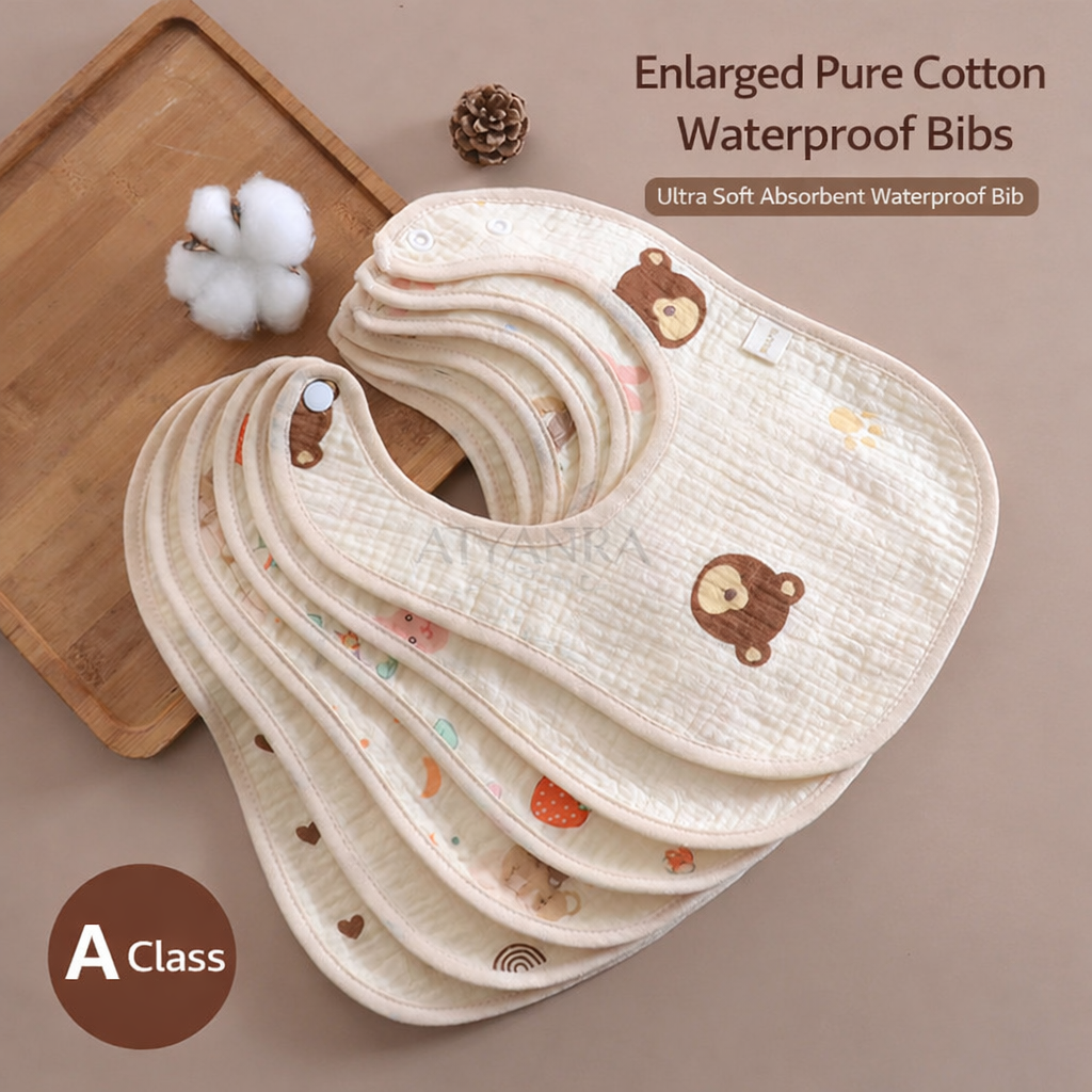Stack of beige baby bibs with bear patterns on a wooden tray against a beige background.