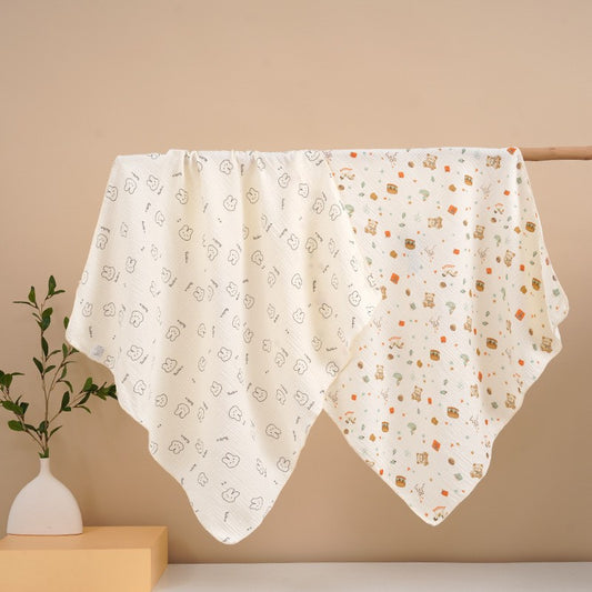 Floral patterned blanket draped over a surface with a beige background